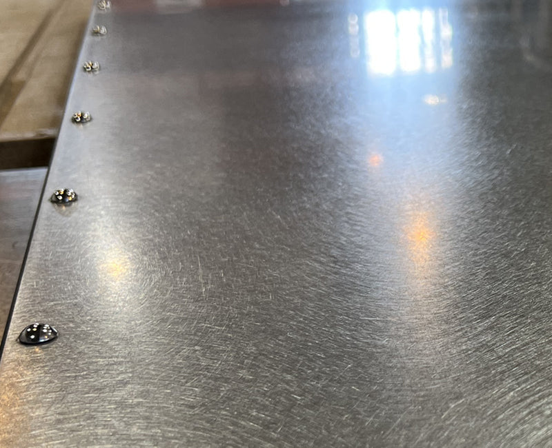 Closeup riveted steel top